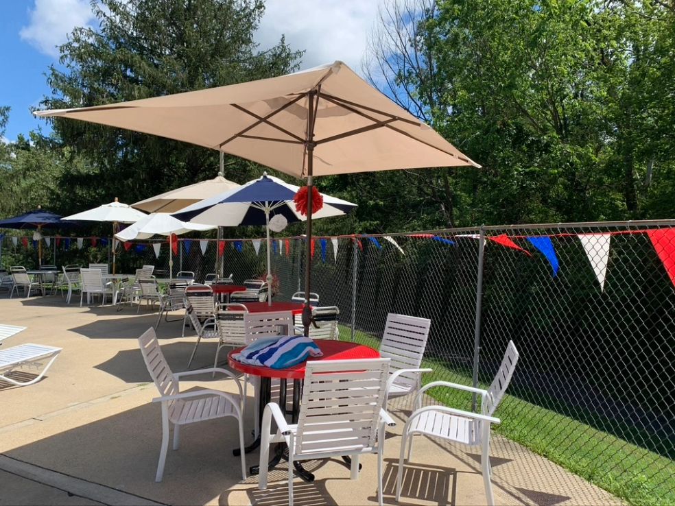 Pool deck with umbrellas and seating